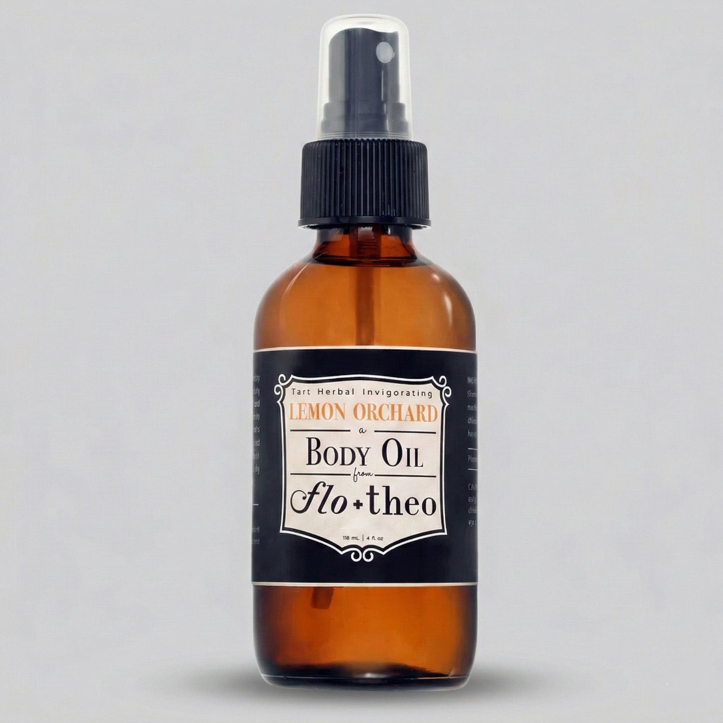 Brown bottle of body oil with a black label on a gray background