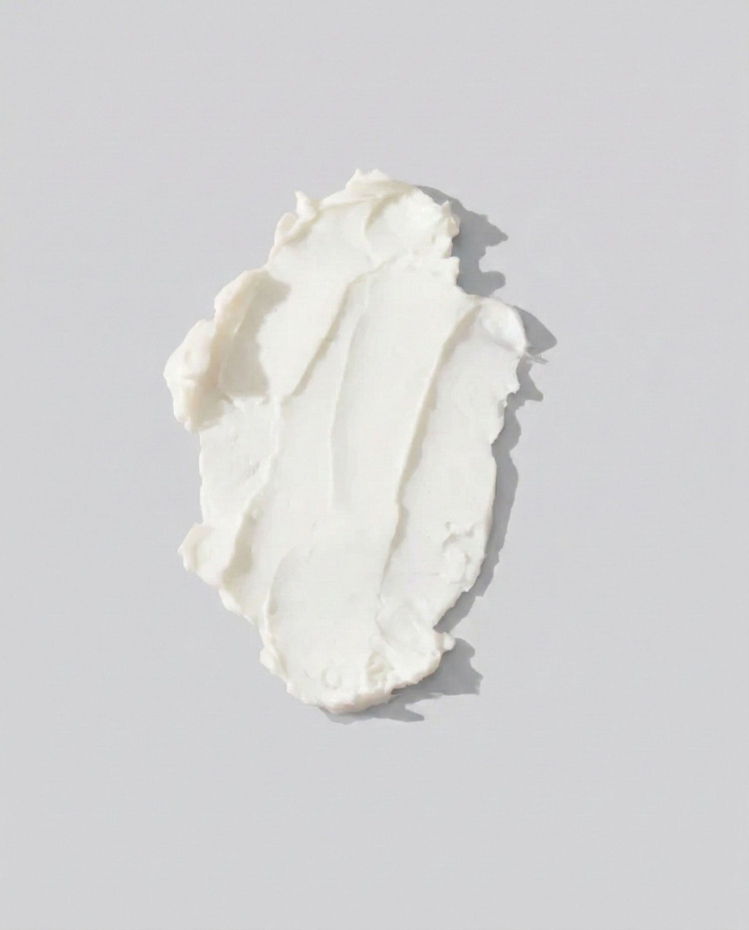 Body butter on a grey background