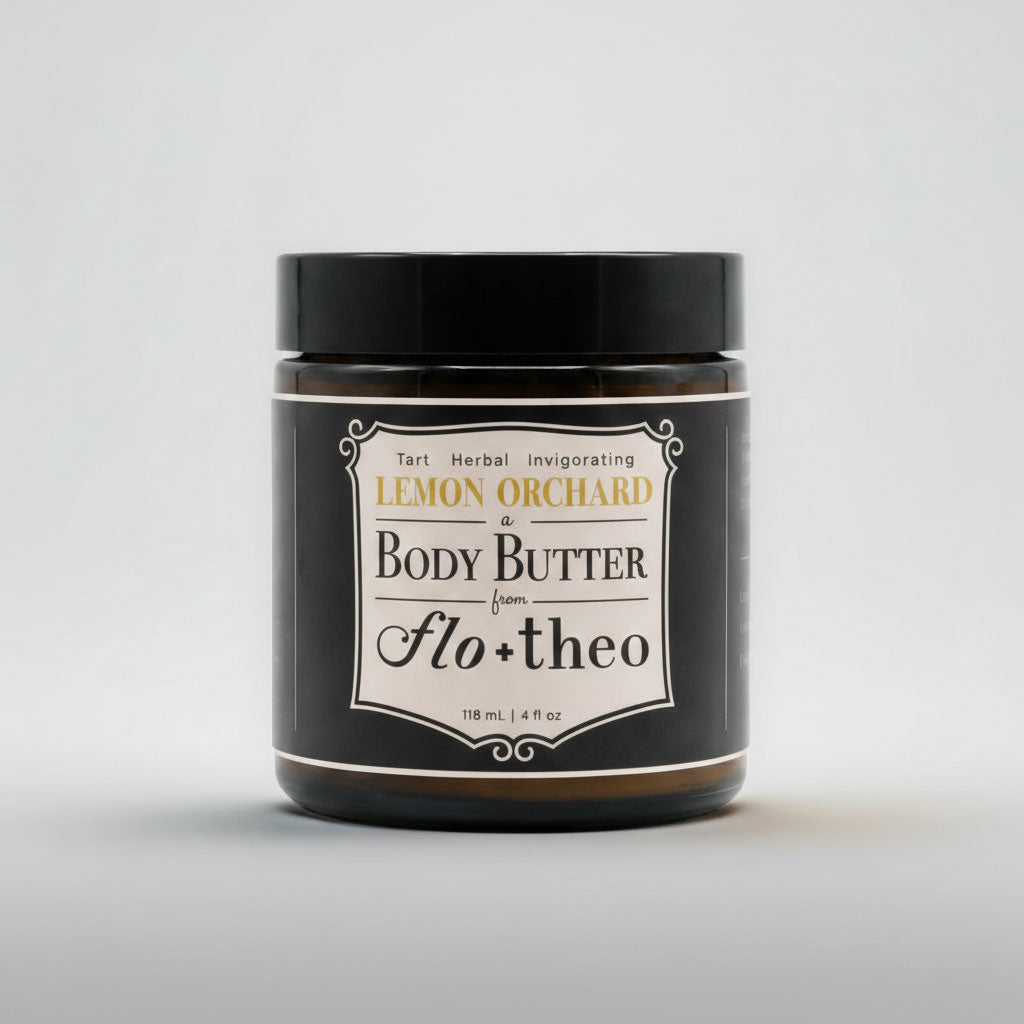 Jar of Lemon Orchard body butter from flo+theo on a light gray background