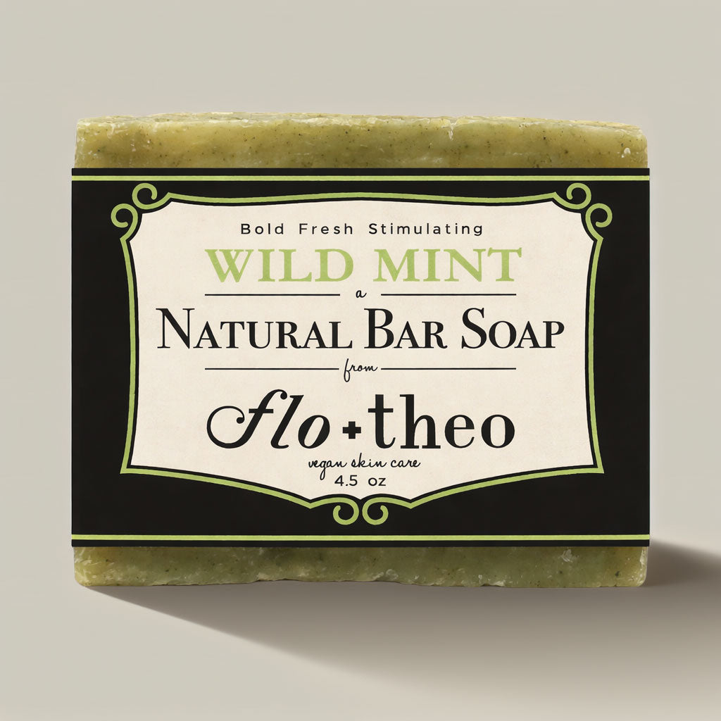 Bar of wild mint natural soap with 'flo theo' branding on a neutral background