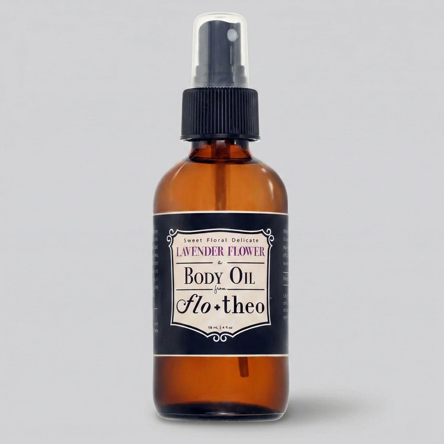 Brown glass bottle of lavender flower body oil with a black label on a gray background