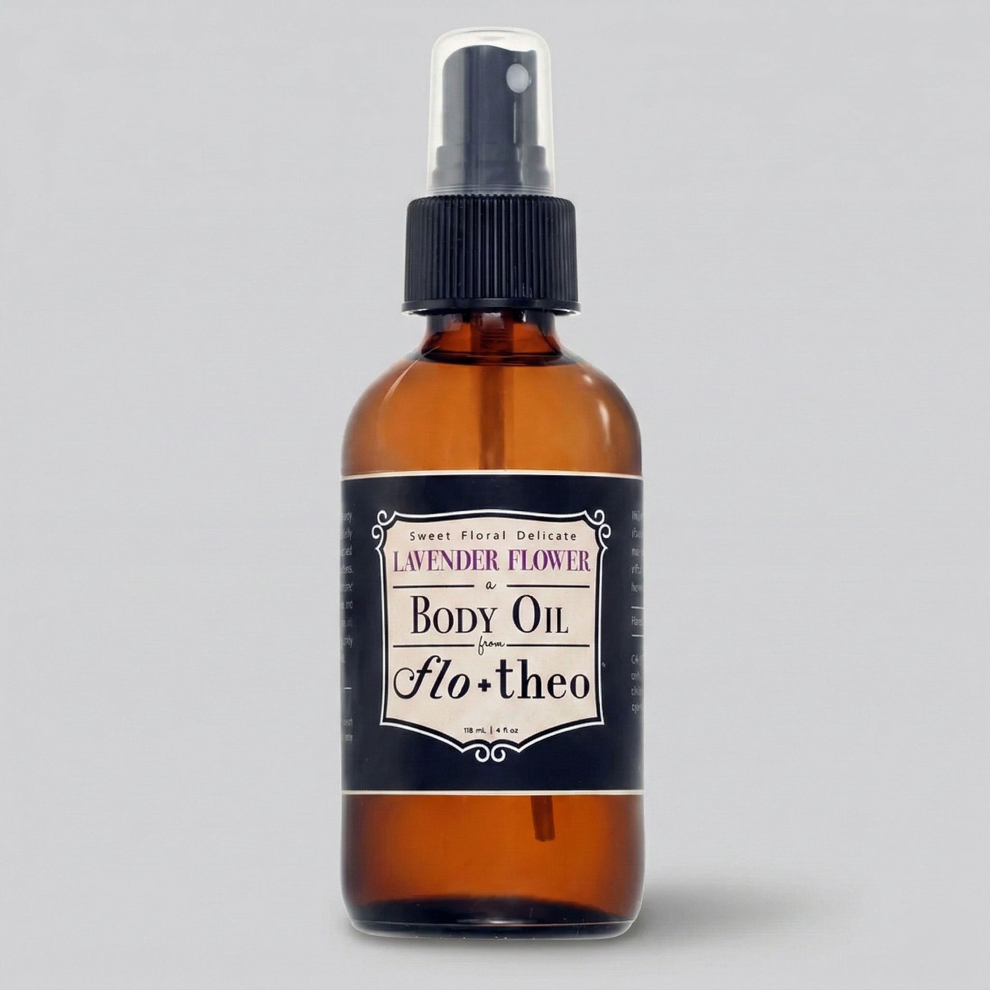 Brown glass bottle of lavender flower body oil with a black label on a gray background