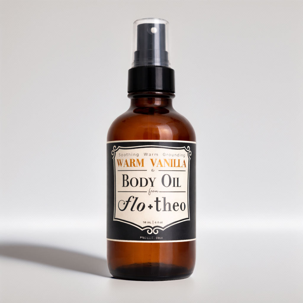 Brown bottle of Warm Vanila body oil with a label on a light gray background